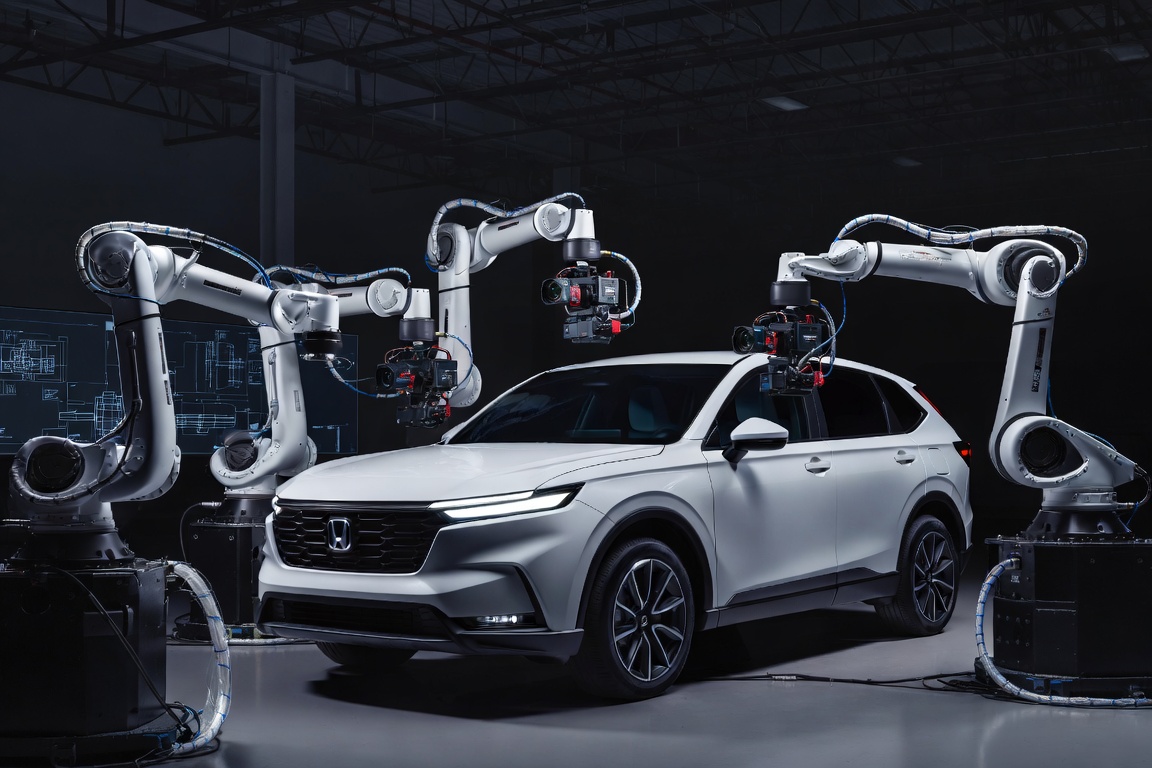 White robots with cameras around Honda SUV